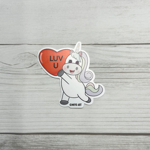 Aurora Unicorn holding a Luv U Heart